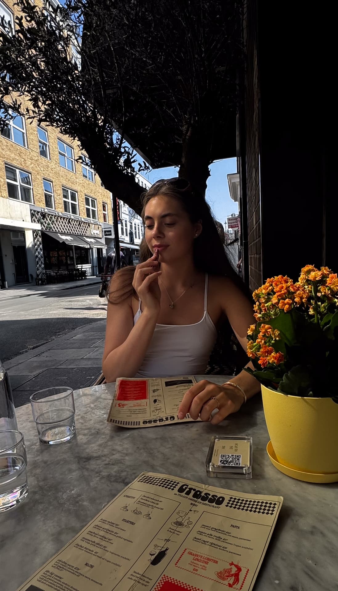 Liana at a café table